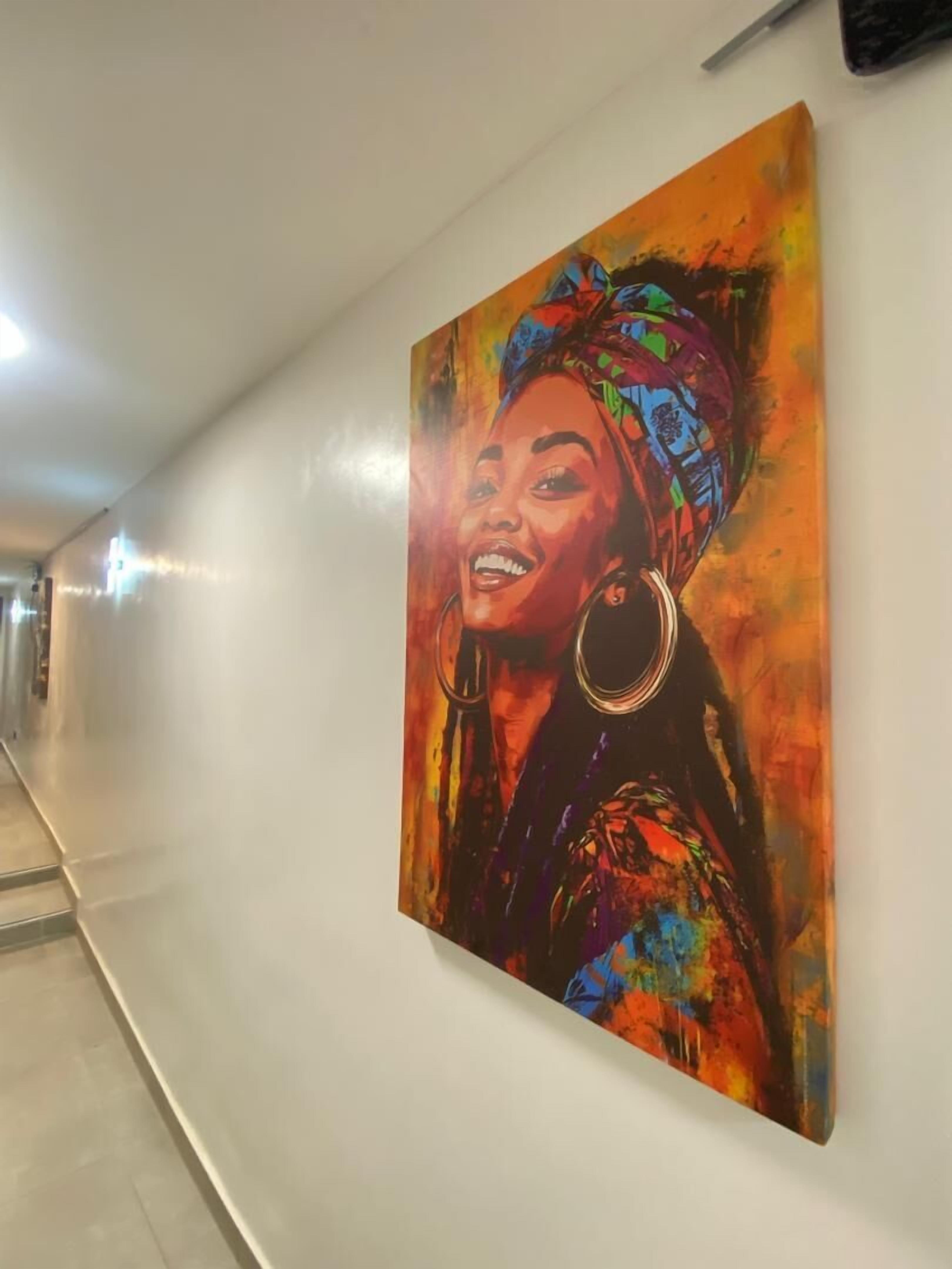 A corridor with a large, colorful painting on the wall.