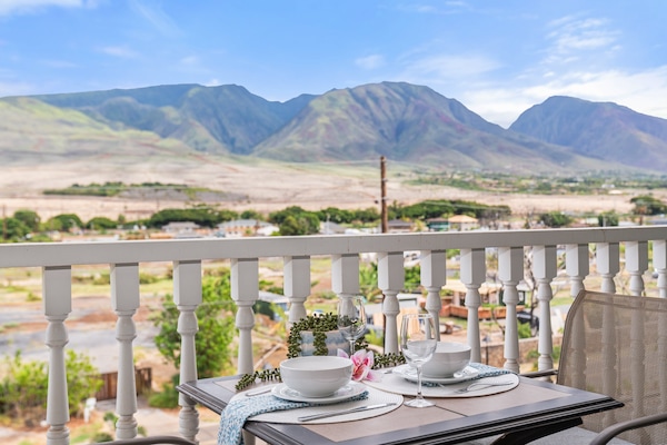 Start your day with breathtaking mountain views from a private balcony, complete with a cozy dining setup. Perfect for sunrise coffee or romantic dinners