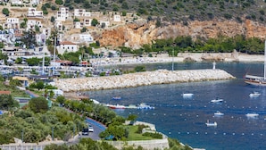 A coastal town with a marina, rocky shoreline, and buildings along the water. - Discover your Kalkan escape – private pool and sea views (Kalkan Centre)