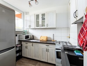 Fridge, microwave, toaster - Przymorze 2-Bedroom Apartment (Gdańsk)