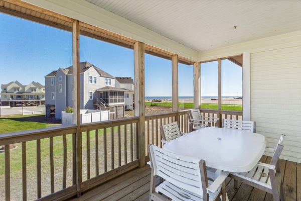 Enjoy morning coffee, evening sunsets, or a relaxing pause with ocean breezes on the screened porch.