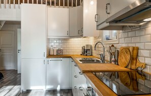 Fridge, stovetop, dishwasher, coffee/tea maker