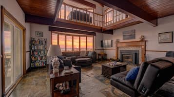 TV, fireplace, books
