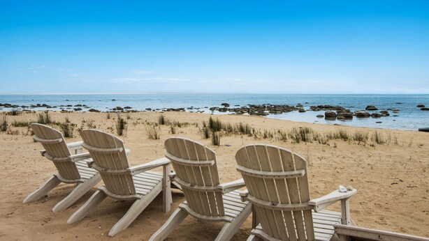 A beach with four wooden Adirondack chairs facing the ocean. - Experience luxury at Thorne Swift Lakehouse, Harbor Springs - Lake Michigan (Harbor Springs)