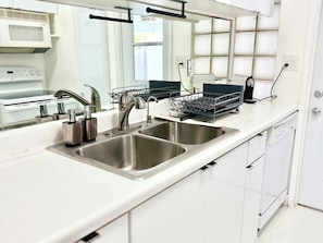Microwave, oven, stovetop, dishwasher - Rove Modern Mid-Century in Victoria Park 2BR Home with Heated Pool and BBQ (Fort Lauderdale)