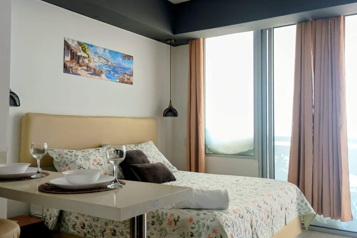 Comfort Quadruple Room, Beach View | Laptop workspace, blackout drapes, soundproofing, iron/ironing board