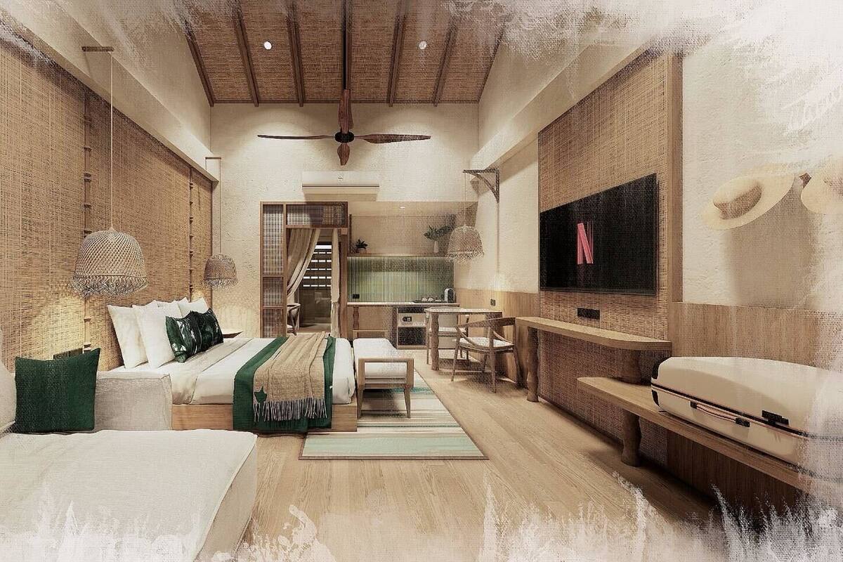 A spacious room with a bed, a desk, and a television.