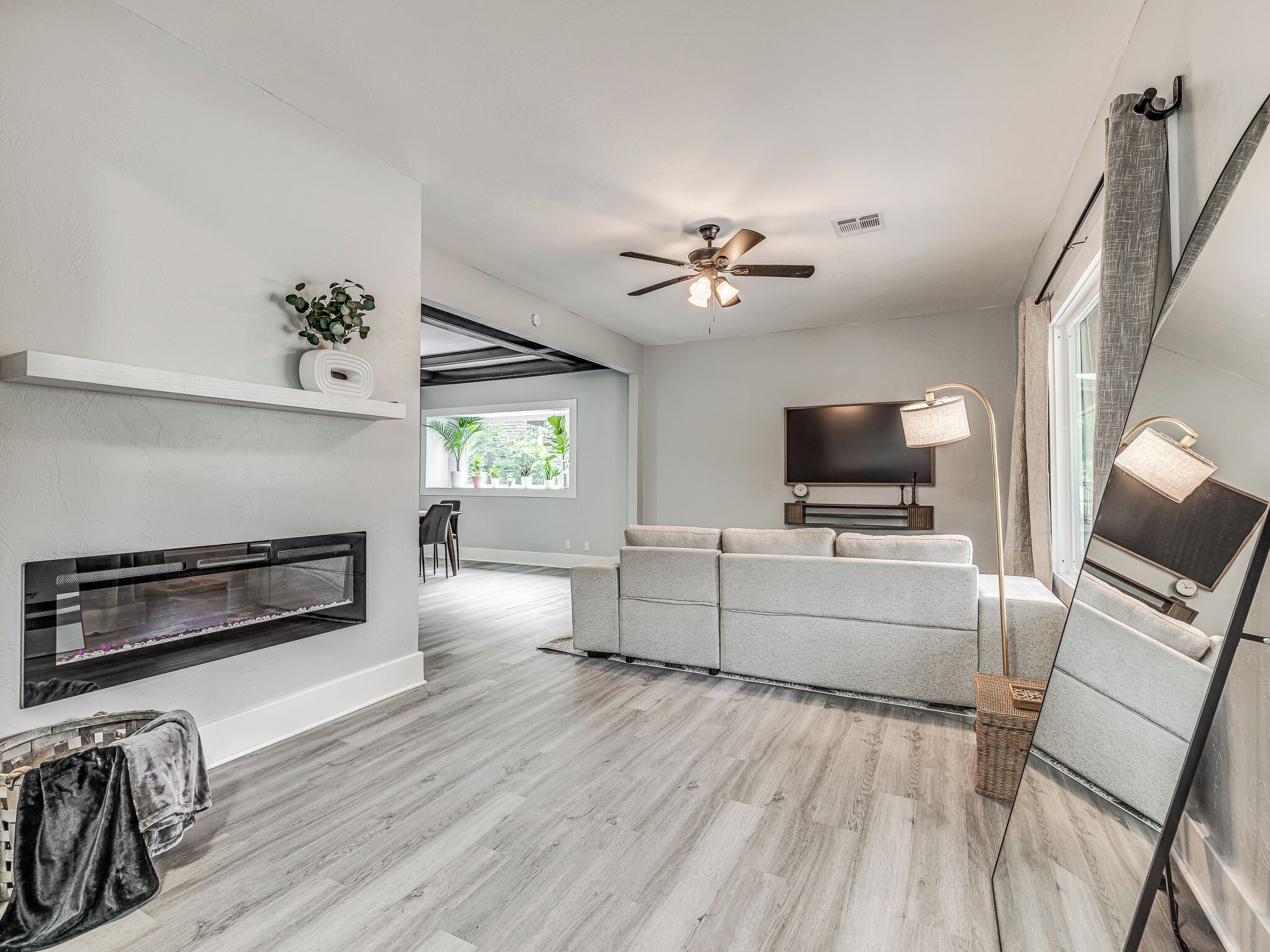 Smart TV, fireplace, books, computer monitors