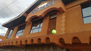 A building with a sign reading "Nomads Trail Hotel".