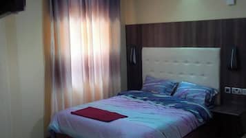 Habitación individual Deluxe, vista a la ciudad | Wifi gratis y ropa de cama