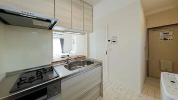 Fridge, microwave, stovetop, cookware/dishes/utensils