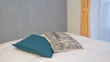 2 室のベッドルーム、WiFi (無料)、ベッドシーツ