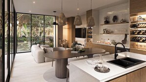 A modern kitchen with a central island, pendant lighting, and a wine rack. - Kachava Lux (Tulum)