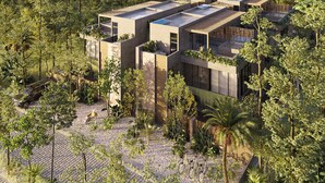 A modern eco-friendly building with multiple levels, surrounded by dense forest. - Kachava Lux (Tulum)