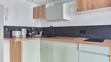 Fridge, microwave, stovetop, coffee/tea maker