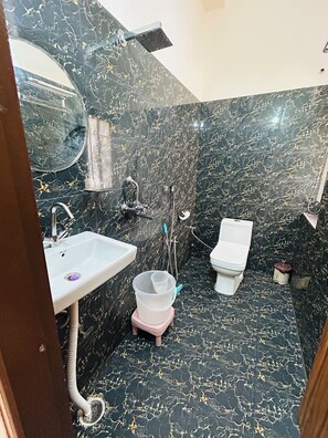 A bathroom with a sink, toilet, and shower. - Hotel DVL INN- Near Jalmahal Jaipur (Jaipur)