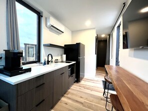 Fridge, microwave, stovetop, coffee/tea maker