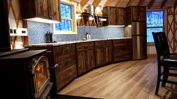 Fridge, stovetop, coffee/tea maker, cookware/dishes/utensils