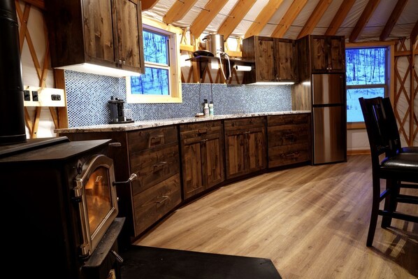 Fridge, stovetop, coffee/tea maker, cookware/dishes/utensils