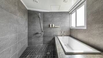 Deluxe Queen Room | Bathroom | Hair dryer, slippers, towels, shampoo