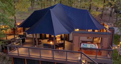 Hot Springs Retreat: Luxe Tented Cabin with Waterfront Views and Hot Tub