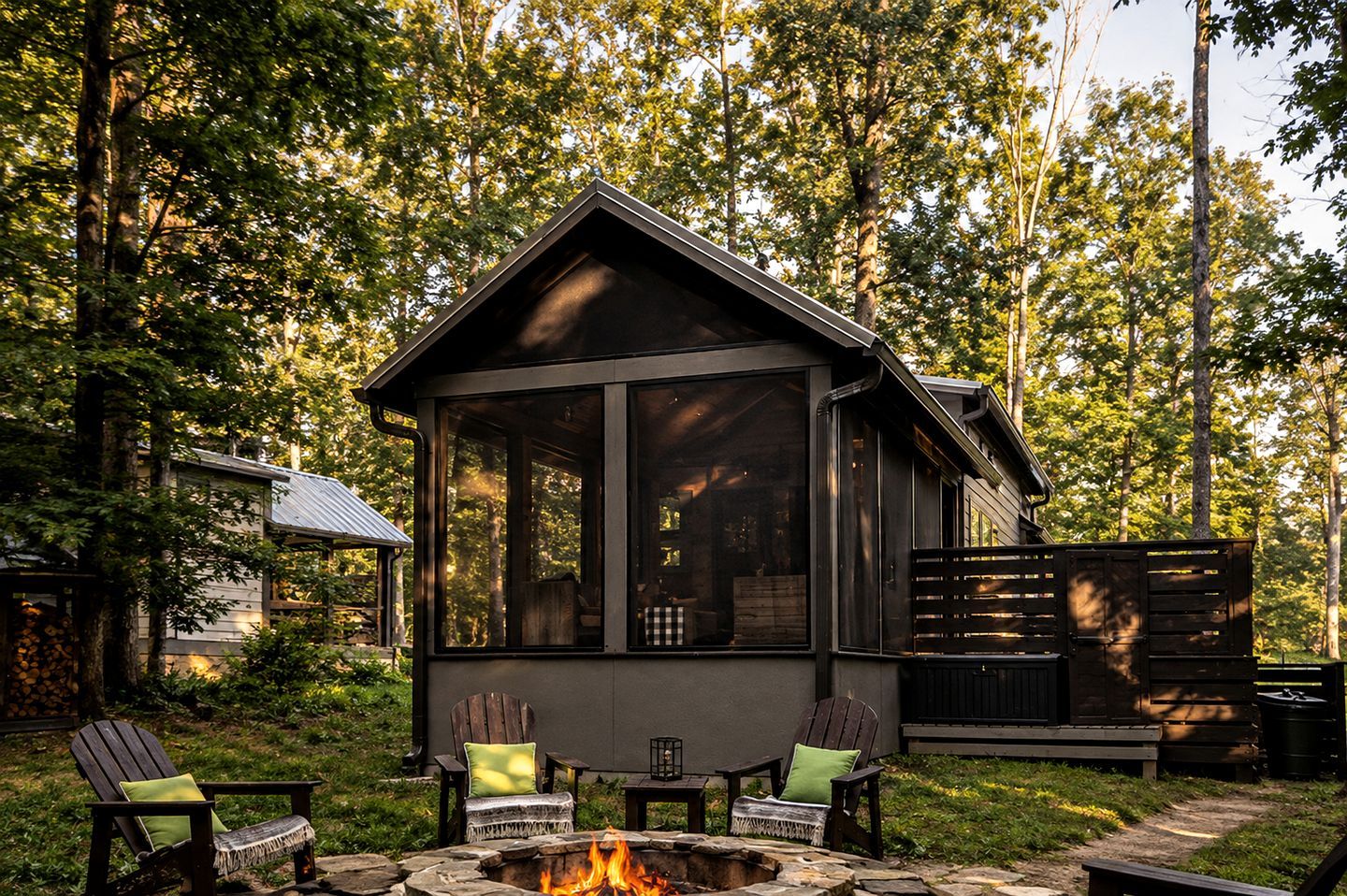 A cabin with a fire pit and outdoor seating.