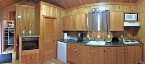 Fridge, microwave, coffee/tea maker, cookware/dishes/utensils