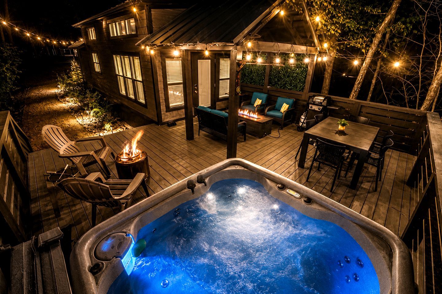 A hot tub surrounded by outdoor seating and a wooden deck.