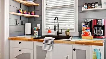 Fridge, microwave, stovetop, coffee/tea maker