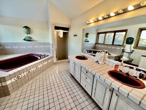 A bathroom with a large bathtub, two sinks, and a shower. - Glorious Cottage Placed in a Secluded Area in Stratton, Vermont (Stratton)