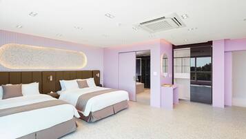 A modern hotel room with two beds, a large mirror, and a view of the outdoors.
