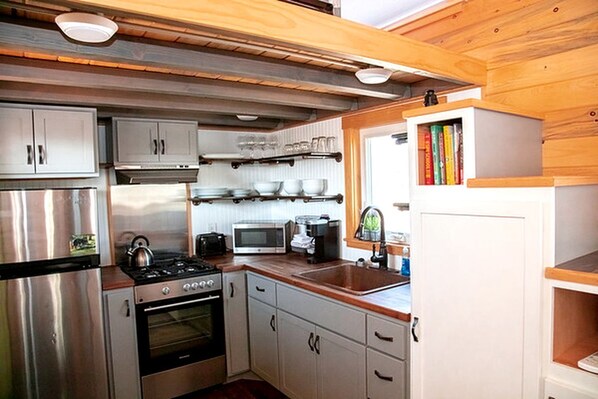 Fridge, microwave, stovetop, coffee/tea maker