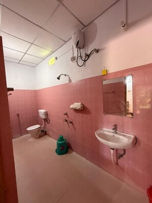 Deluxe Room | Bathroom | Shower, towels, soap, toilet paper - Megha Resort And Restaurant (Port Blair)