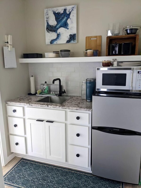 Fridge, microwave, coffee/tea maker, toaster
