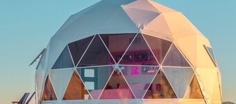 Luminous Cozy Dome with a Barbie Collection Above Bed in Willcox, Arizona