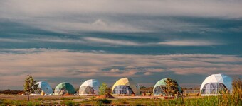 Luminous Cozy Dome with a Barbie Collection Above Bed in Willcox, Arizona