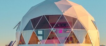 Luminous Cozy Dome with a Barbie Collection Above Bed in Willcox, Arizona