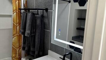 Hair dryer, towels, soap, shampoo