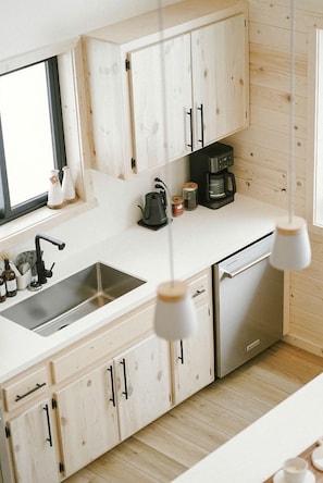 Private kitchen - Riverside Retreat: Unwind in a Cabin with Private Steam Sauna on the Pine River (Mission Township)