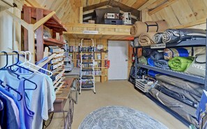A room with a lending library, rental center, and shelves with various items.