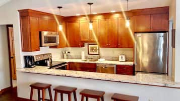 Fridge, stovetop, coffee/tea maker, cookware/dishes/utensils