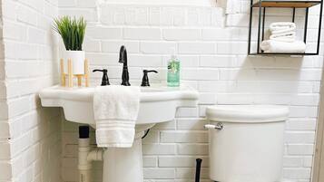 Shower, towels, soap, toilet paper