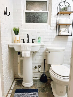 Shower, towels, soap, toilet paper