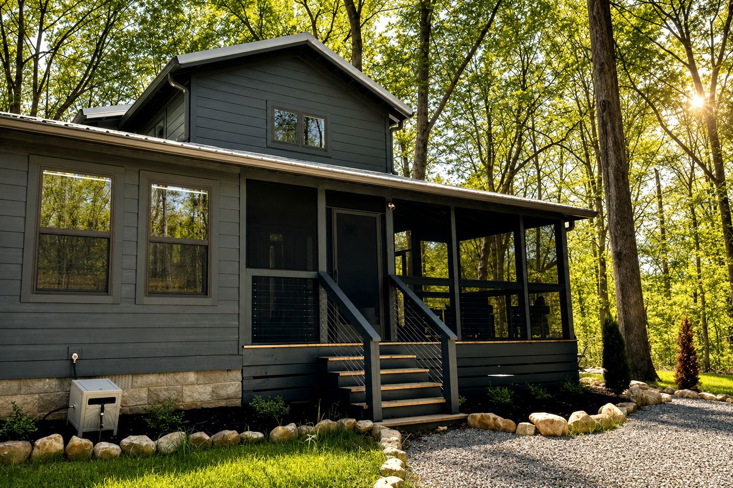A two-story house with a covered porch and a stone foundation.