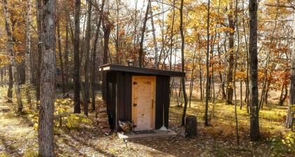 Cabin Charm by the Pine: Pet-Friendly Retreat in Mission Township's Riverside Haven