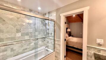 Jetted tub, hair dryer, towels, soap