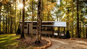 A cabin with a porch, surrounded by trees and a gravel path. - Incredible Secluded Cabin wit Barbecue and Privileged Sights in Tracy City, Tennessee (Tracy City)