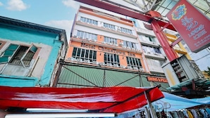A multi-story building with a sign for "Hotel ChinaTown Inn" and a "Swing & Pillows" shop. - Swing & Pillows at Chinatown (Kuala Lumpur)