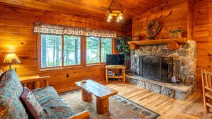 Fireplace - Getaways to Big Lake Minnesota in this Charming Log Cabin for 6 (Ely)