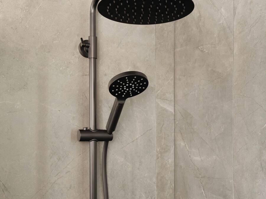 A modern shower with a curved head and a handheld showerhead.